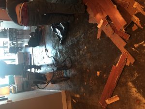 Water and fire damage restoration crew drying a home