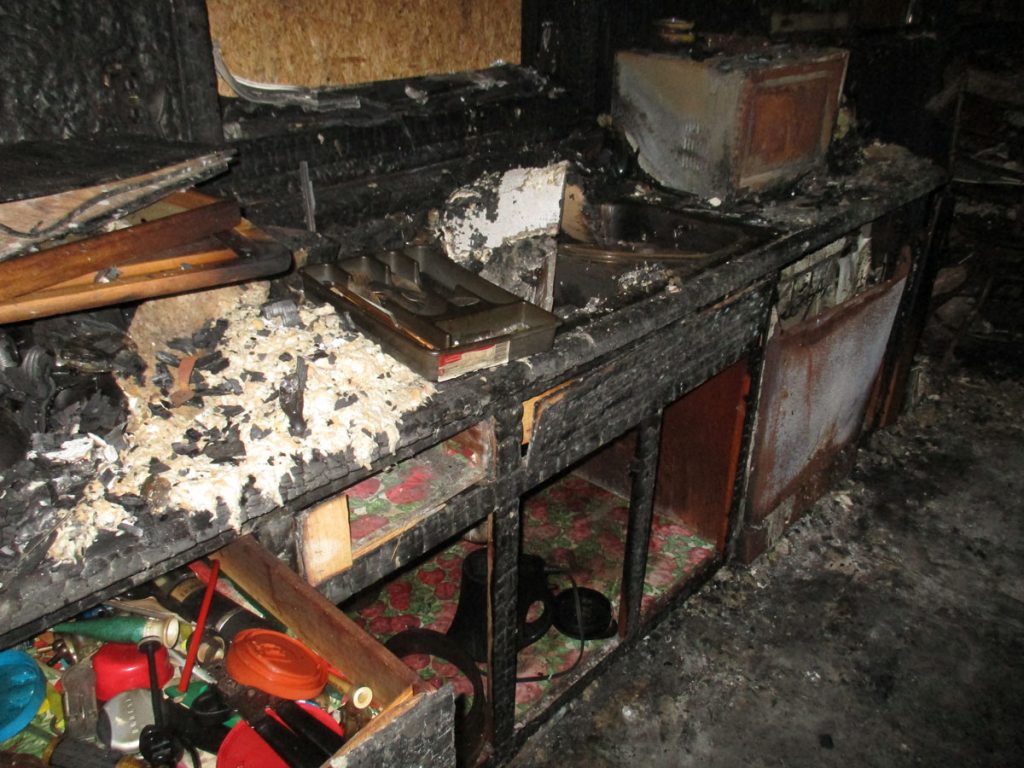Soot damage repair needed on walls and ceiling after a house fire