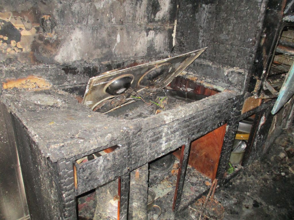 Fire damage repair inside a Marietta home with soot on the walls and ceiling