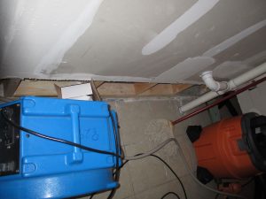 Flooded basement floor where sewage backup cleanup starts with extraction