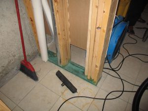 Sewage backup in Decatur: a wet basement floor during cleanup